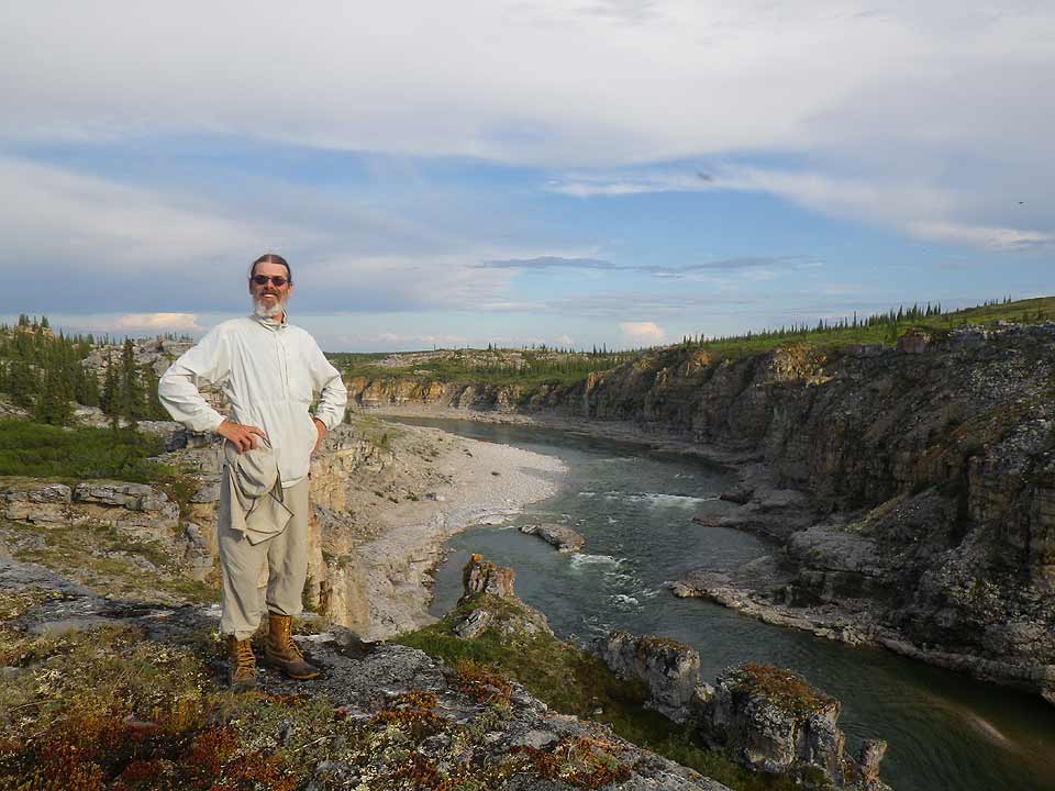 Brian Johnston stands on the rim of the third canyon above the Horton River.